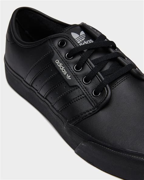 black adidas sneakers for men.